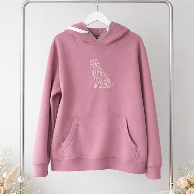 Pink hoodie with text on a hanger against a light gray background