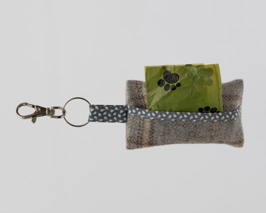 Keychain with pouch and green card on a light gray background