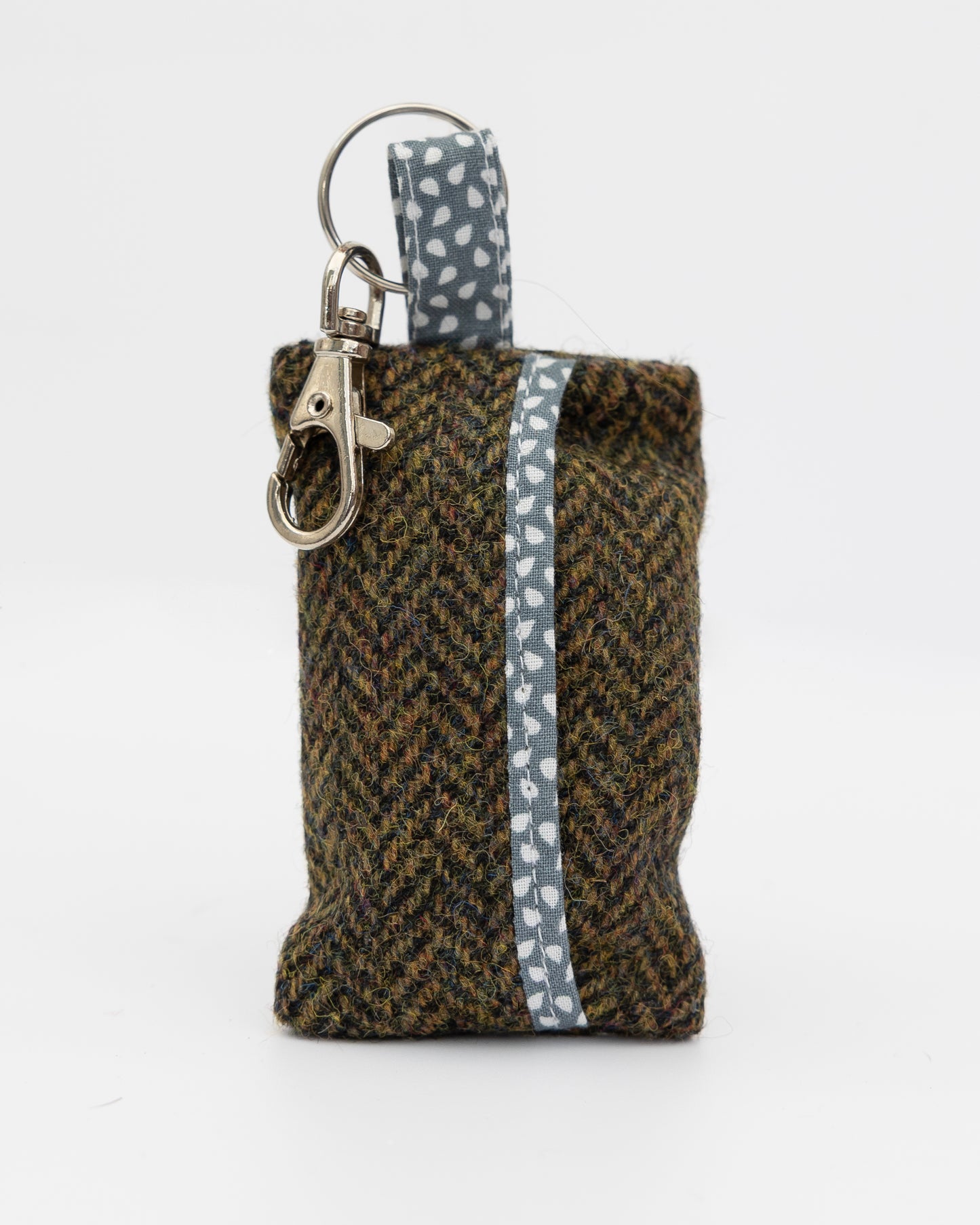 Harris Tweed pouch with keychain on a white background