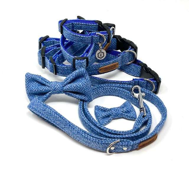 A set of British tweed dog collar, lead, and bow tie in various shades of blue and patterns, displayed on a white background.
