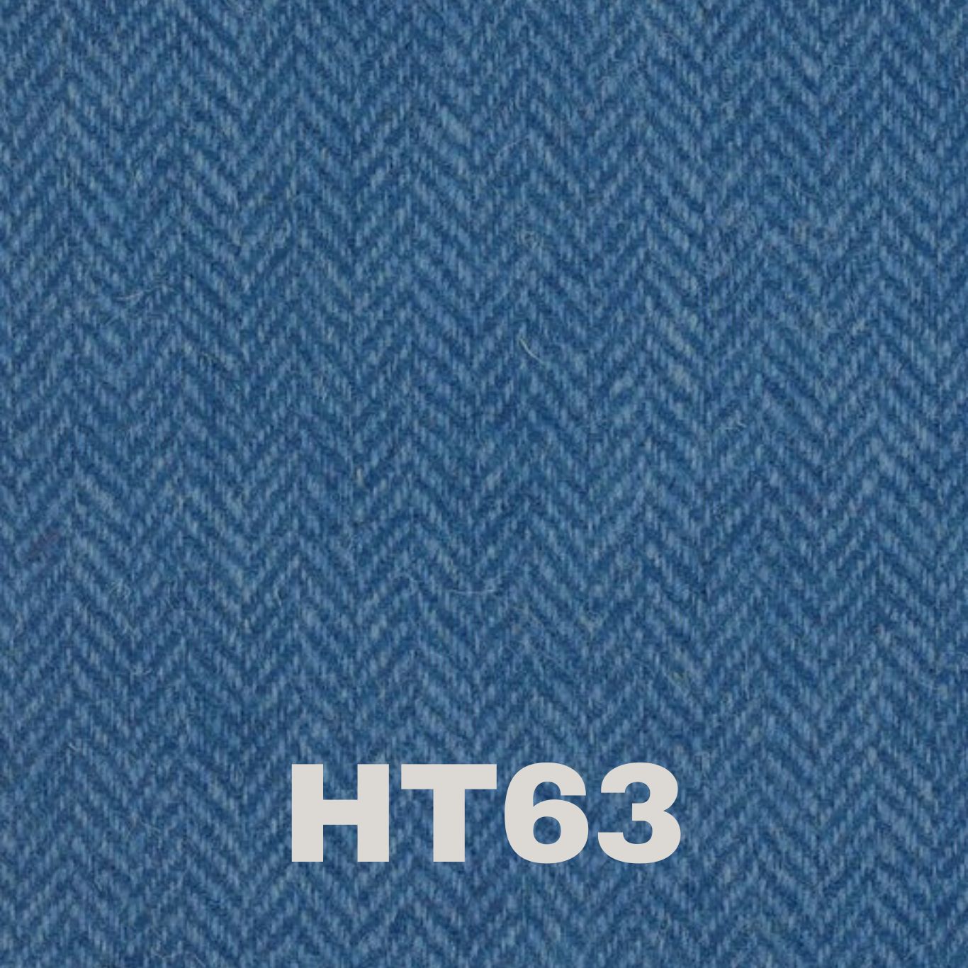 Rich blue Harris Tweed fabric with a herringbone texture, perfect for adding elegance to products like the Malt Whisky Scented Soy Candle by Created By The Ridleys.