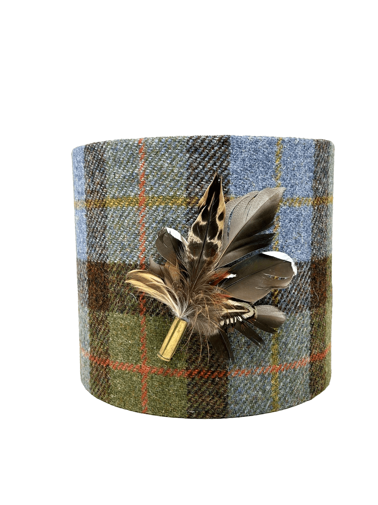 A cylindrical lampshade made of Harris Tweed with a plaid pattern and decorated with real pheasant feathers attached to the top.