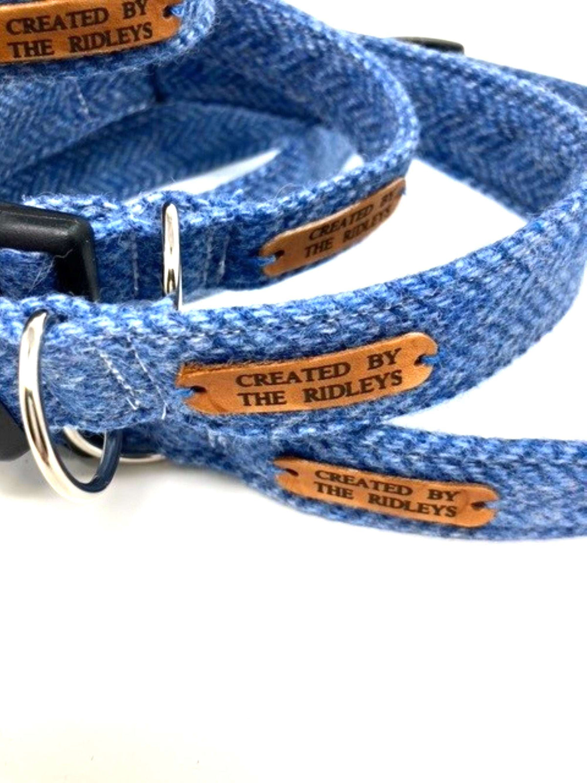 Close-up of a Handmade Blue Herringbone Tweed Dog Collar featuring a contoured buckle, made by Created By The Ridleys, showcasing its durability with a nylon webbing lining.