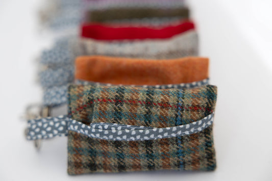 Set of fabric pouches with different patterns and colors on a white background