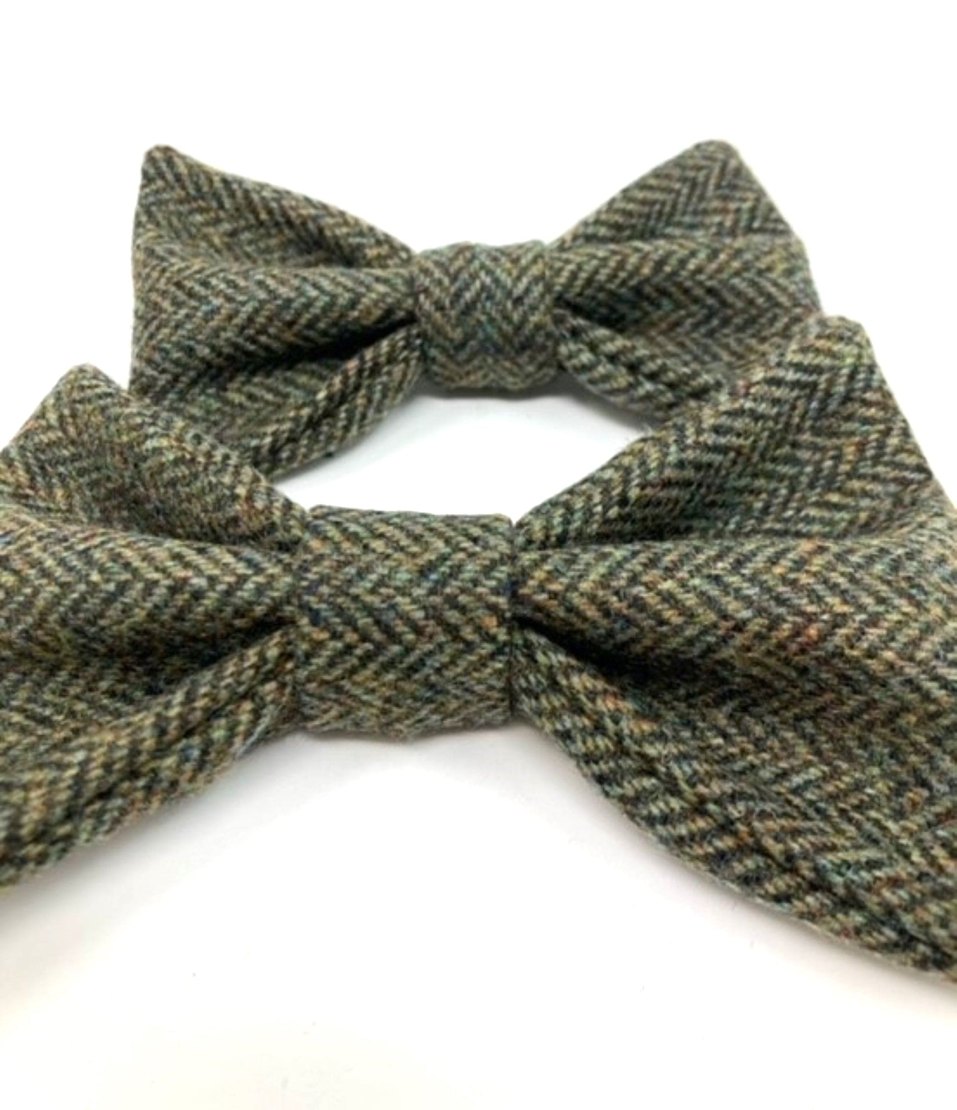 Handmade Moss Herringbone Tweed Dog Collar Bow Ties by Created By The Ridleys, showcasing exquisite craftsmanship and luxurious design.