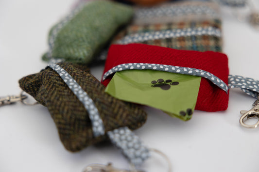 Keychains with paw print design on a white surface