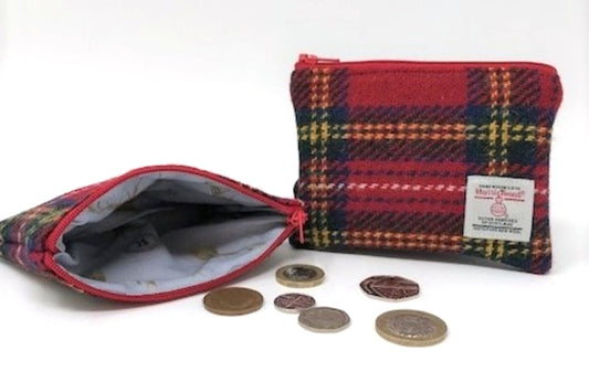 Handwoven Harris Tweed Coin Purse by Created By The Ridleys, showcasing the luxurious Scottish wool exterior and Stag lining, surrounded by coins.