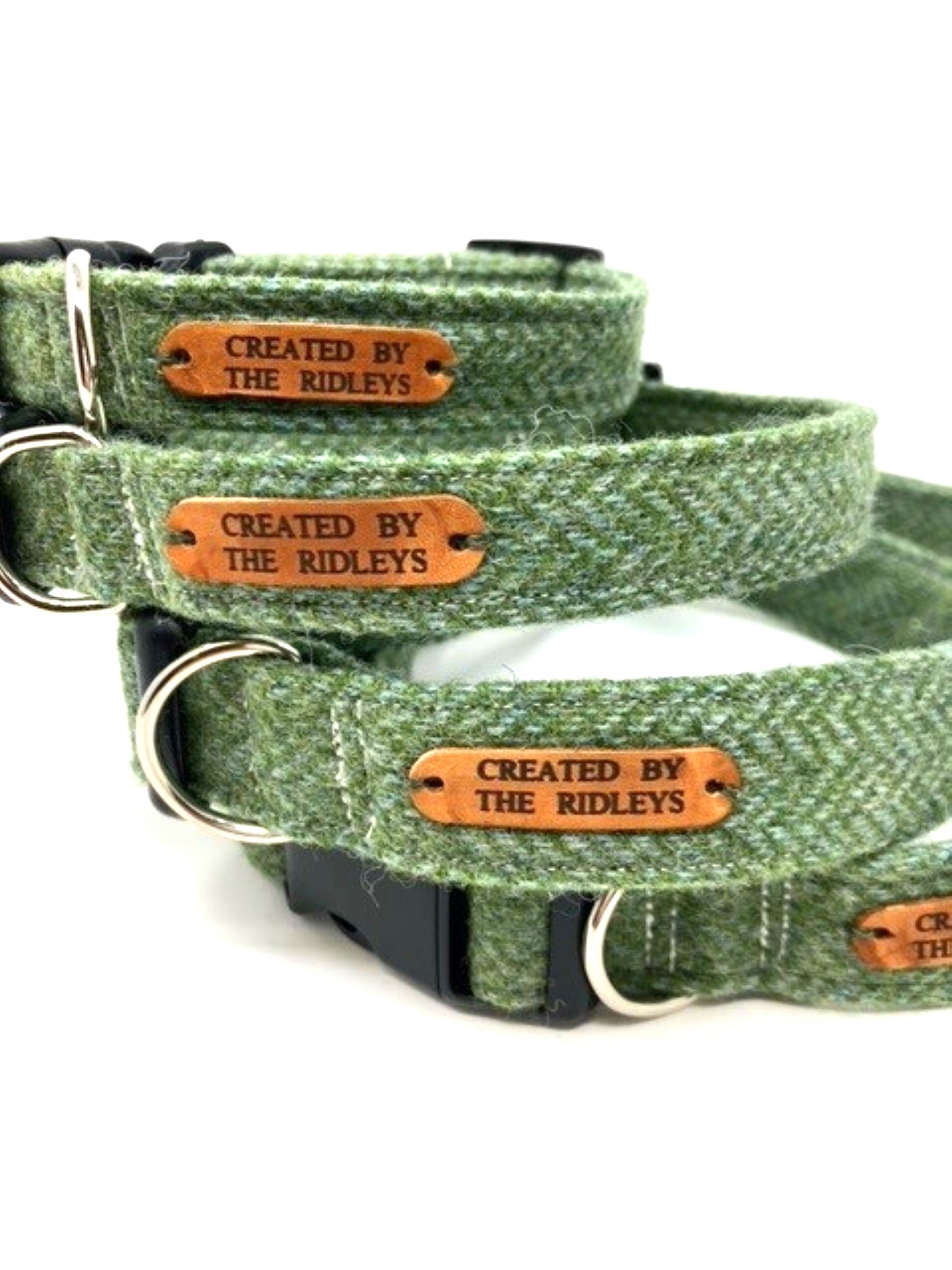 Close-up of Handmade Green Herringbone Tweed Dog Collars with leather tags, crafted by Created By The Ridleys, highlighting durability and style.