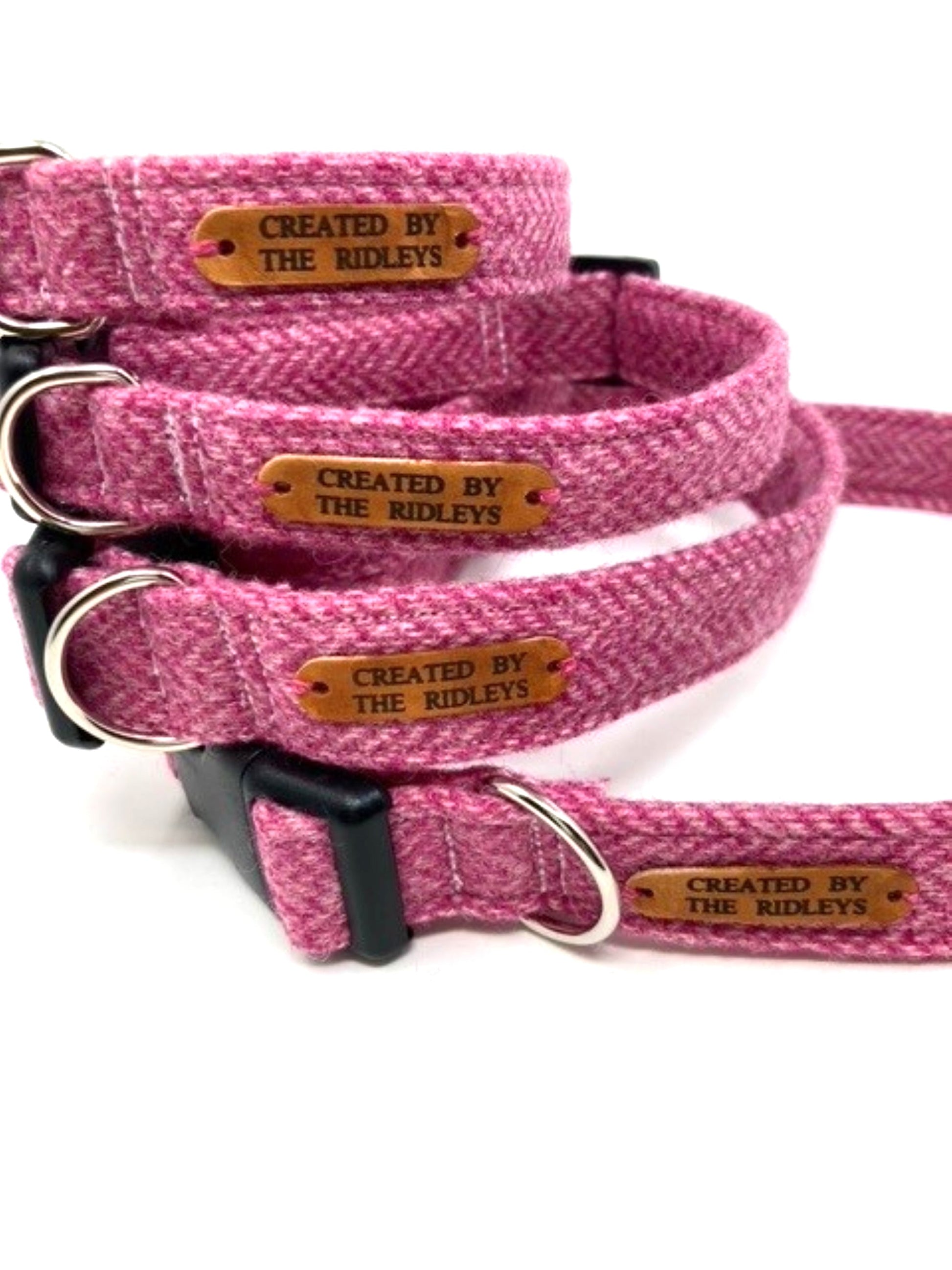 Handmade Pink Herringbone Tweed Dog Collar collection by The Ridleys featuring strong buckles and custom sizes, showcasing a stylish design perfect for your pet.